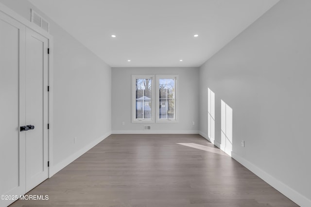 spare room featuring hardwood / wood-style floors