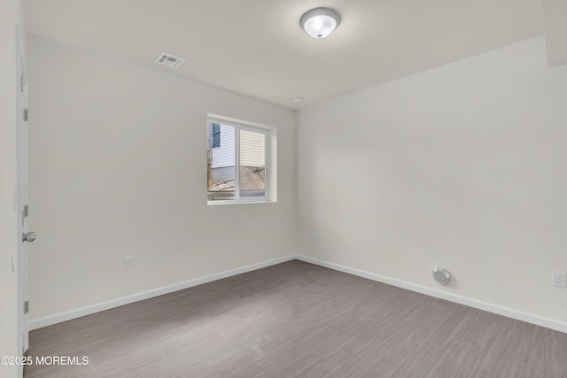 empty room featuring dark hardwood / wood-style floors