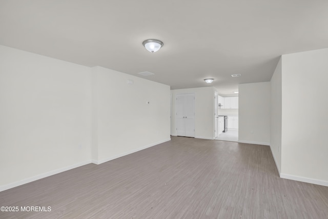 empty room featuring hardwood / wood-style floors