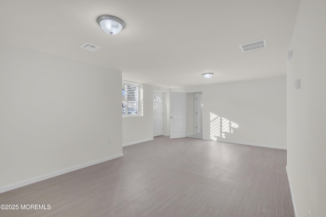 spare room with light hardwood / wood-style floors