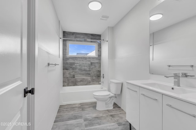 full bathroom with vanity, toilet, and tiled shower / bath