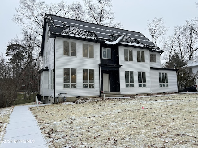 view of front of property with solar panels