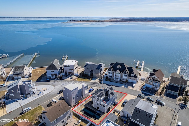 bird's eye view with a water view and a residential view