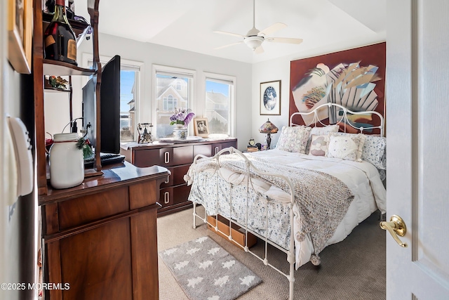 bedroom featuring light carpet and ceiling fan