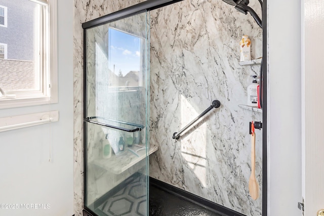 interior space featuring a marble finish shower