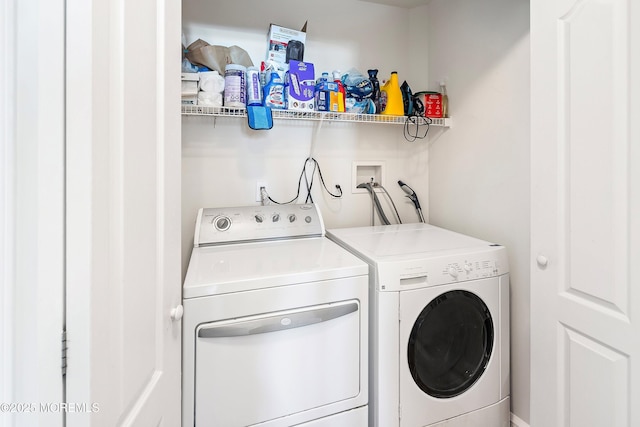 clothes washing area featuring laundry area and independent washer and dryer