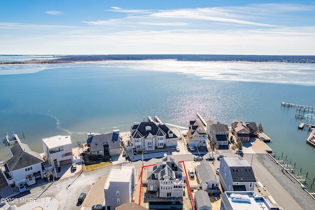 aerial view featuring a water view and a residential view