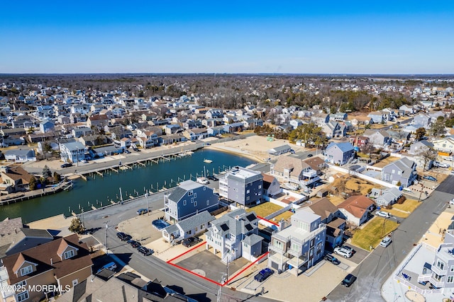 birds eye view of property featuring a residential view and a water view