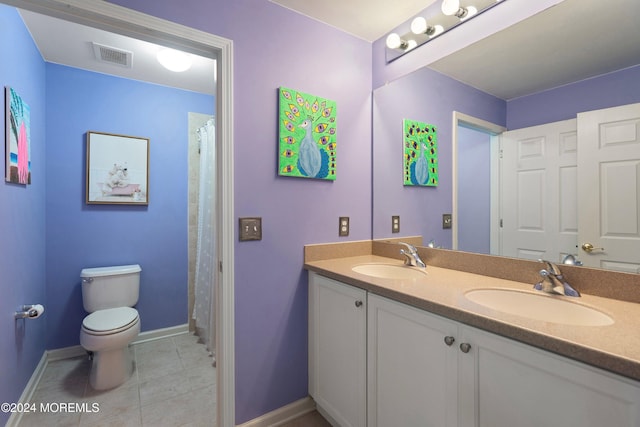 bathroom with tile patterned floors, vanity, toilet, and a shower with curtain