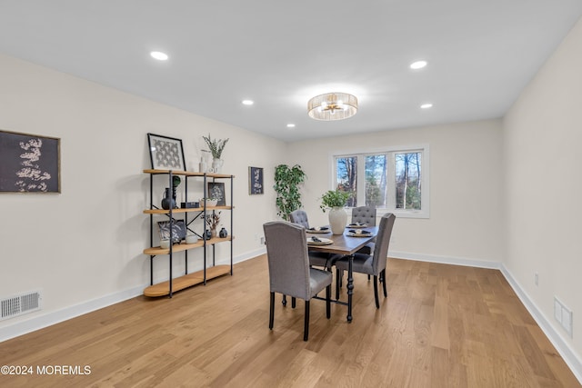 dining area with light hardwood / wood-style floors