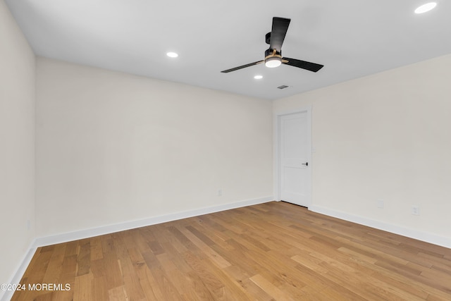 unfurnished room featuring ceiling fan and light hardwood / wood-style flooring