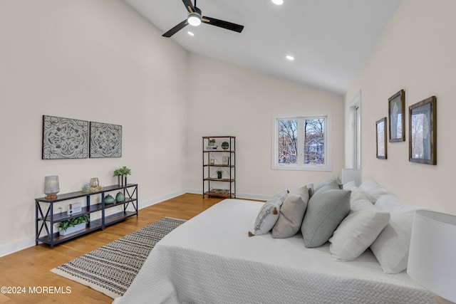 bedroom featuring ceiling fan, high vaulted ceiling, and wood-type flooring