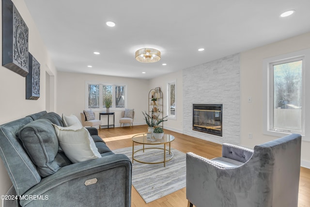 living room featuring light hardwood / wood-style floors and a fireplace