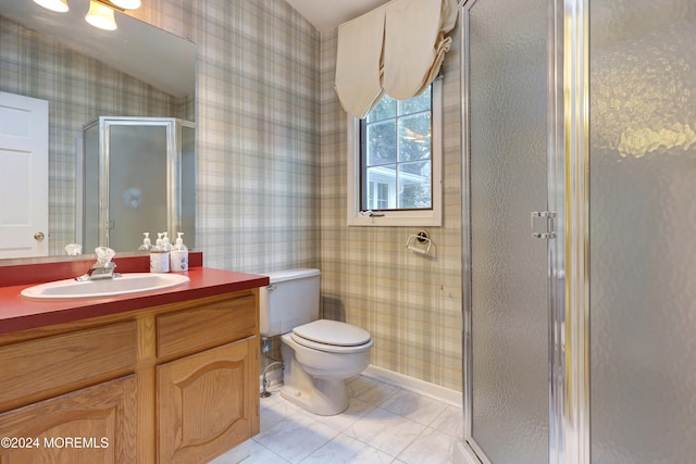 bathroom featuring tile patterned floors, vaulted ceiling, an enclosed shower, toilet, and vanity