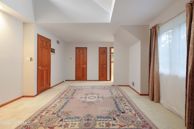 interior space featuring light colored carpet