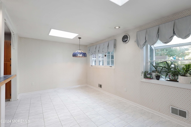 dining area featuring a skylight