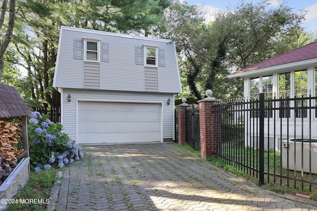 view of property exterior with a garage