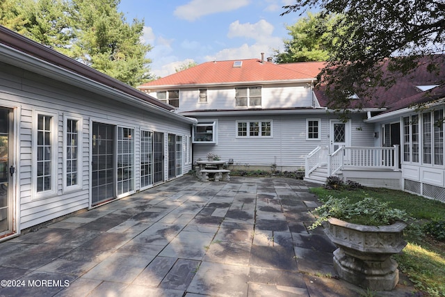 rear view of house featuring a patio area