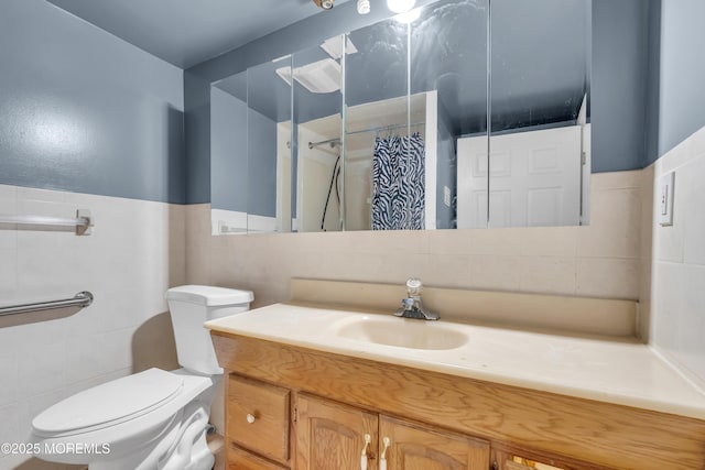 bathroom featuring a shower with curtain, vanity, tile walls, and toilet