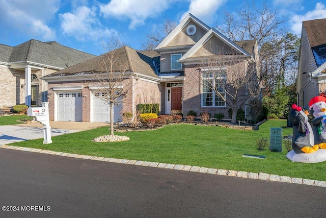 view of front property featuring a front lawn and a garage