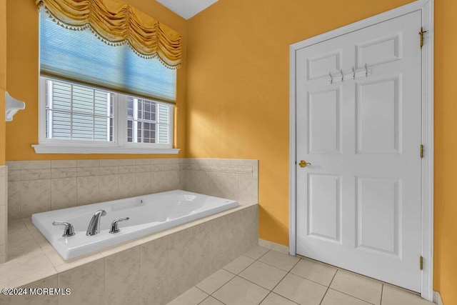 bathroom featuring tiled bath and tile patterned floors