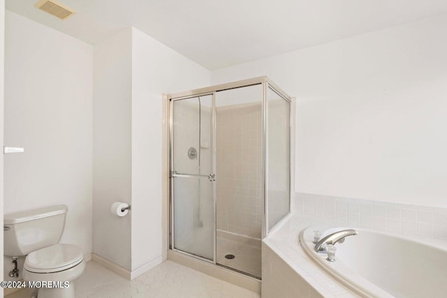 bathroom with tile patterned flooring, toilet, and plus walk in shower