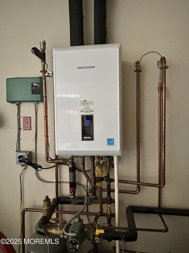 utility room with tankless water heater