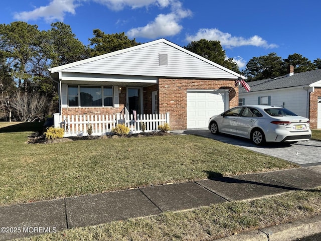 view of front of home featuring a garage and a front lawn