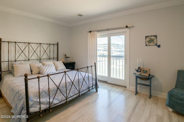 bedroom with access to exterior, light hardwood / wood-style flooring, and ornamental molding