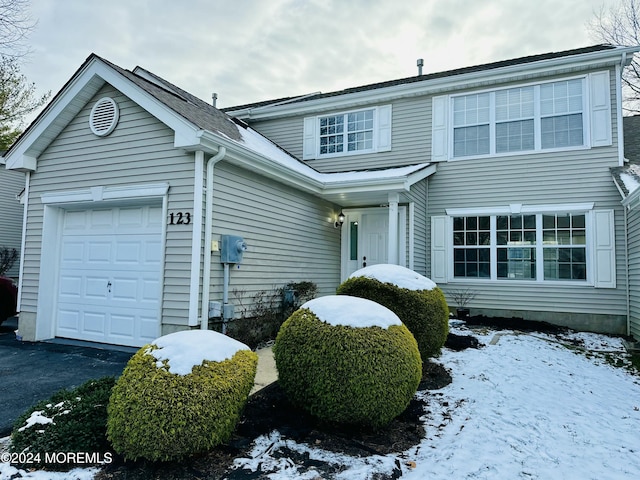 front of property with a garage