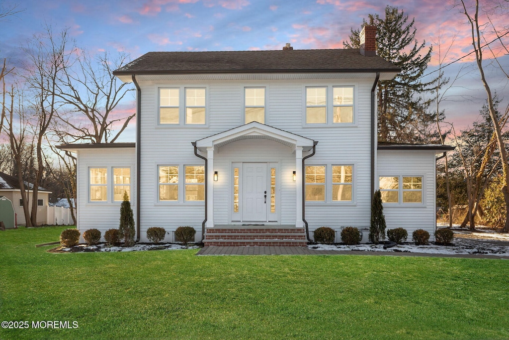 view of front of home featuring a yard