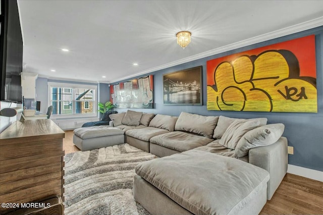 living room featuring hardwood / wood-style flooring and ornamental molding