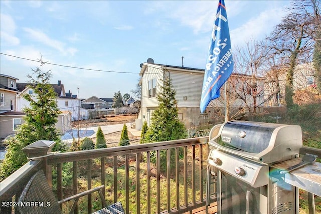 wooden terrace with area for grilling