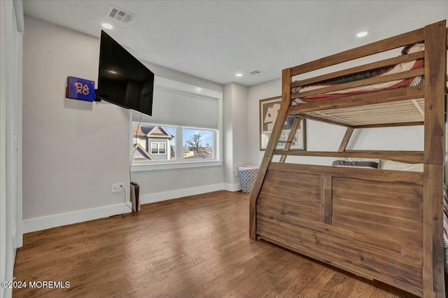 bedroom featuring dark hardwood / wood-style floors