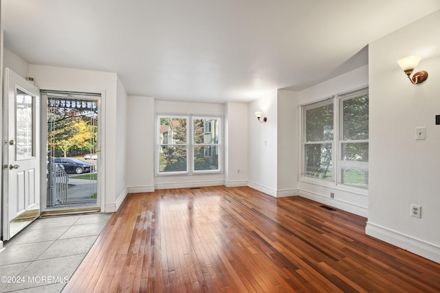 interior space featuring hardwood / wood-style floors and a healthy amount of sunlight