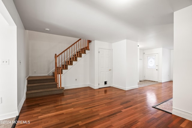 unfurnished living room with hardwood / wood-style flooring