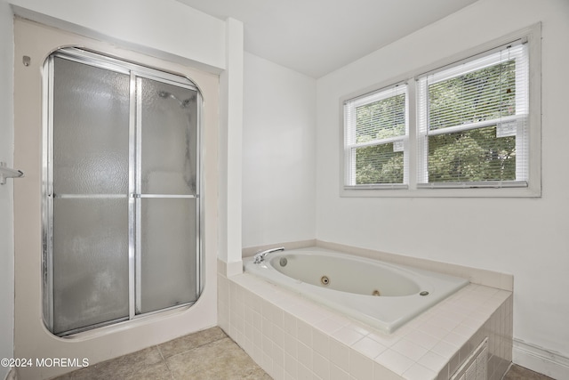 bathroom with tile patterned flooring and plus walk in shower