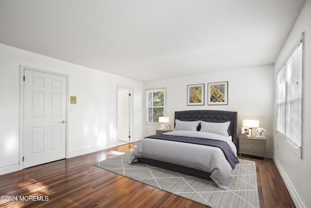 bedroom featuring dark hardwood / wood-style flooring