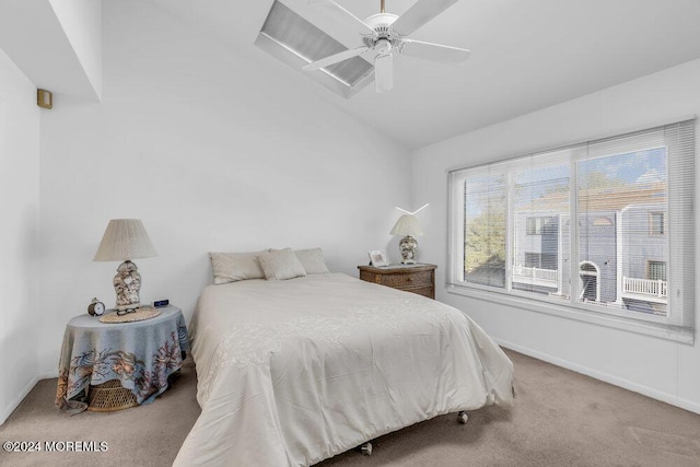 carpeted bedroom featuring ceiling fan and lofted ceiling