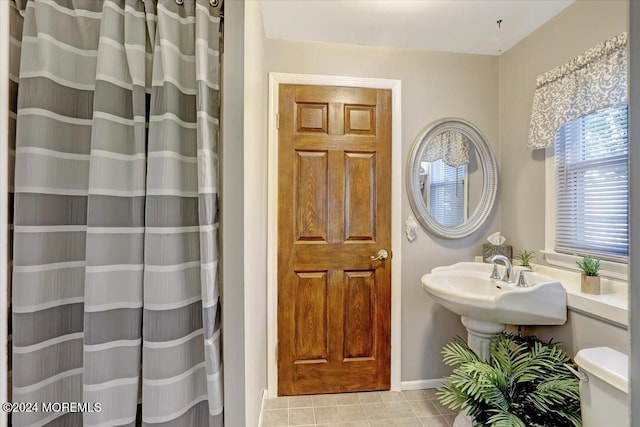 bathroom with tile patterned floors and sink