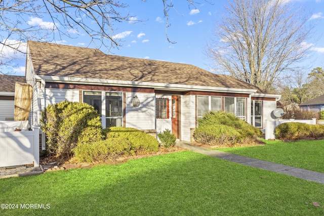 view of front of home with a front yard