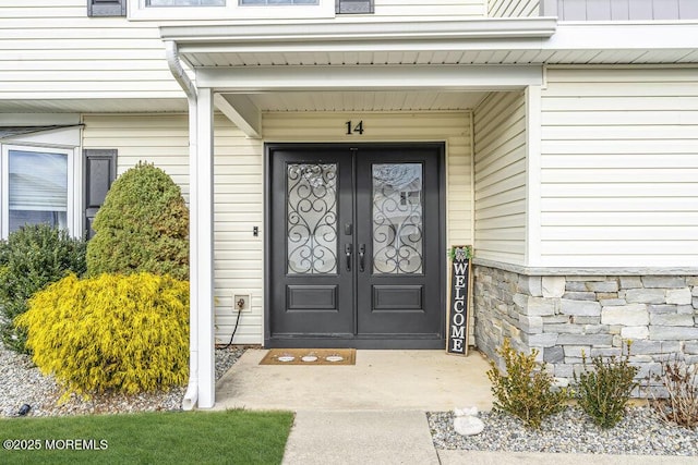 view of exterior entry featuring french doors