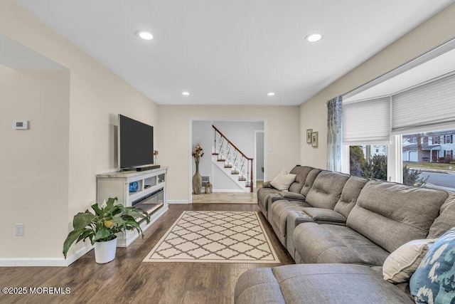 living room with dark hardwood / wood-style flooring