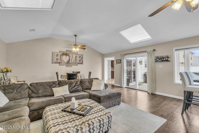 living room featuring ceiling fan, lofted ceiling, and hardwood / wood-style flooring