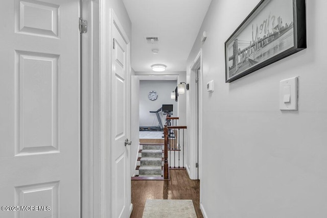 hall with dark hardwood / wood-style flooring