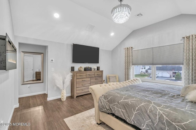 bedroom with lofted ceiling, a chandelier, and dark hardwood / wood-style floors