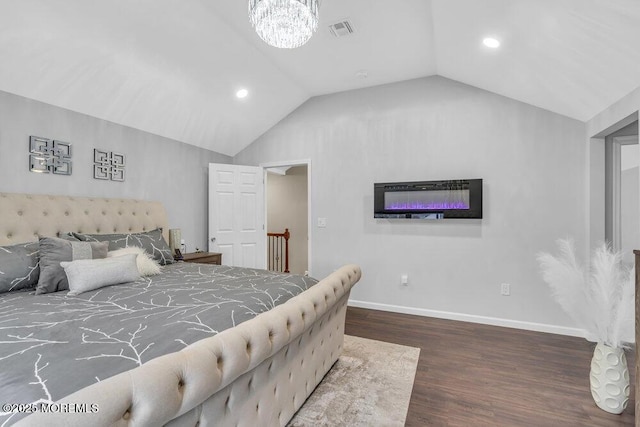 bedroom featuring a notable chandelier, dark hardwood / wood-style flooring, and vaulted ceiling