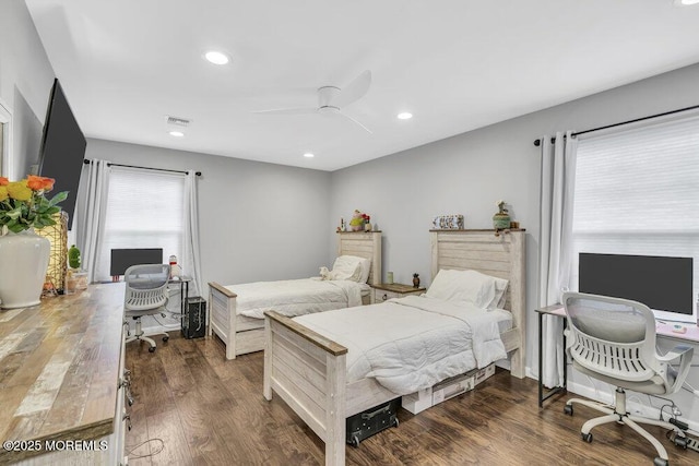 bedroom featuring ceiling fan and dark hardwood / wood-style flooring