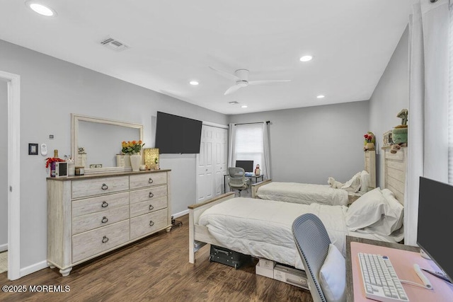 bedroom with a closet, ceiling fan, and dark wood-type flooring