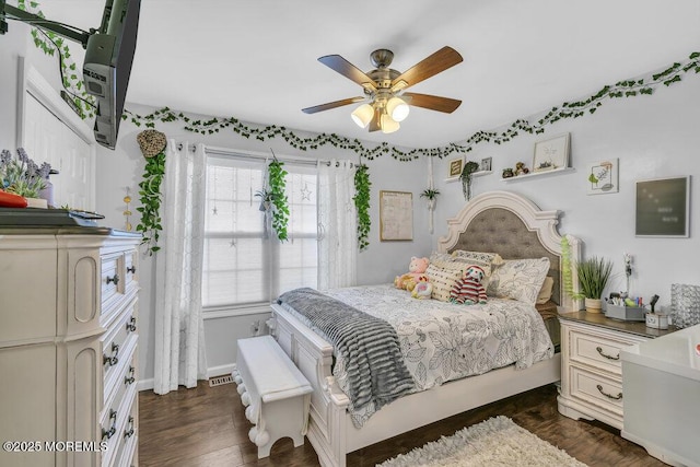 bedroom featuring dark hardwood / wood-style floors and ceiling fan